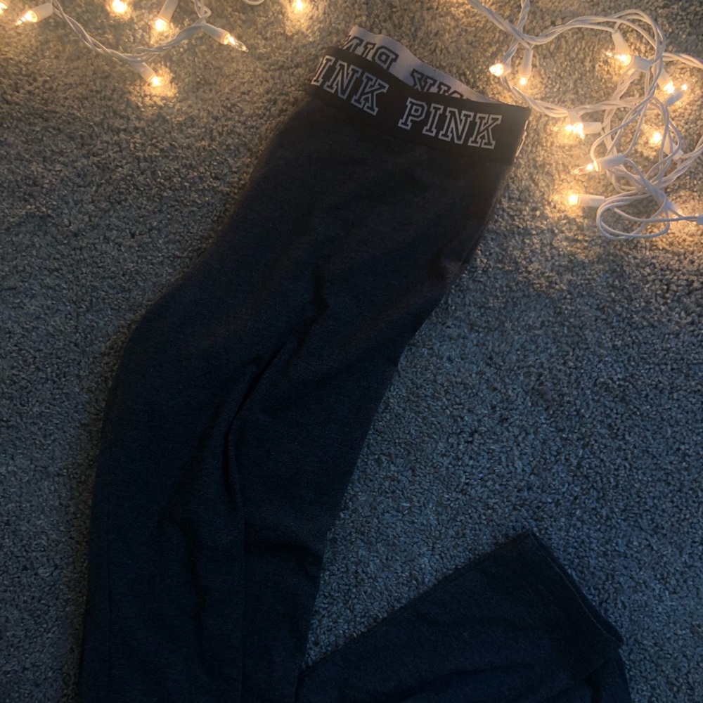 Grey leggings, pink logo waistline